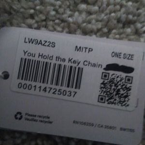 I am selling a never used "You Hold It" Keychain